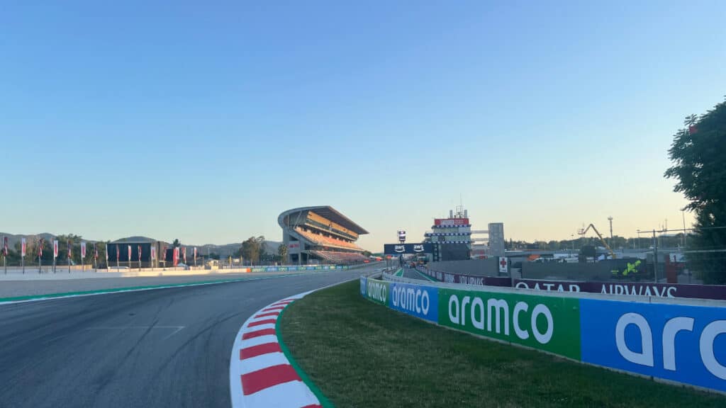 Wide-angle view of the empty main straight and grandstands at the Circuit de Barcelona-Catalunya during the 2026 pre-season shakedown.