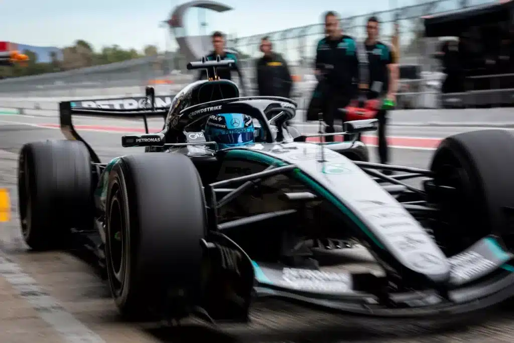 George Russell exiting the pit lane in the Mercedes W17 during the final stages of the 2026 Barcelona shakedown.
