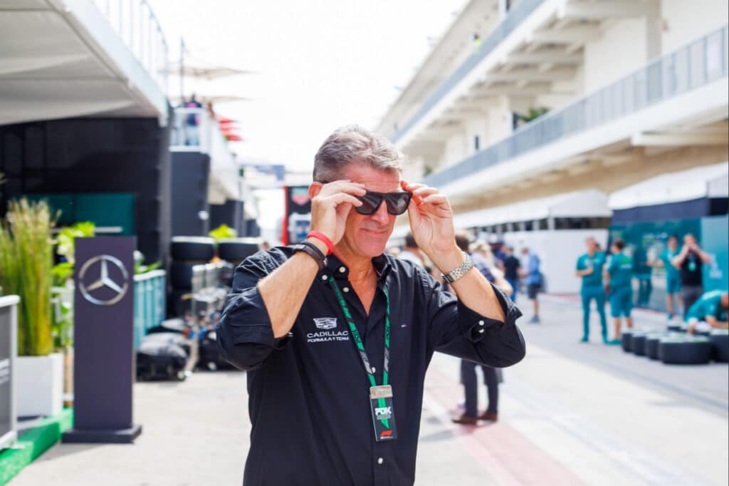 Senior Cadillac Formula 1 Team personnel in the paddock at Silverstone, representing the technical leadership and development discipline of the GM F1 project.
