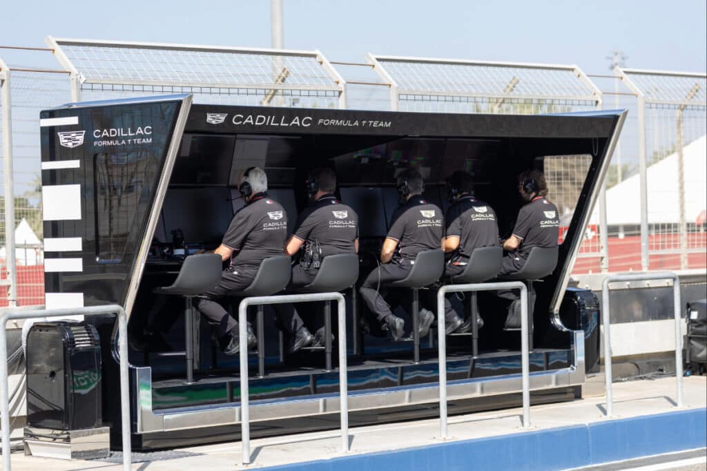 Cadillac F1 Team engineers sitting at the pit wall monitoring data during 2026 Bahrain testing.