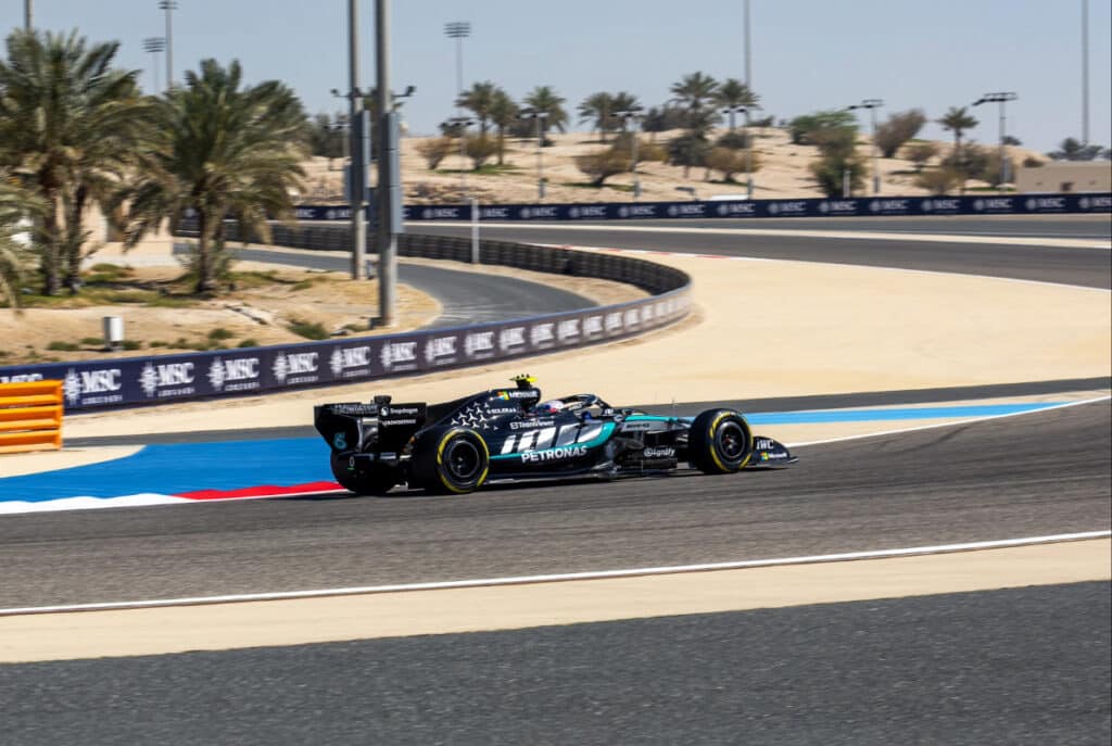 Side view of George Russell driving the Mercedes W17 through a corner at the Bahrain International Circuit during Day 4 of pre-season testing.
