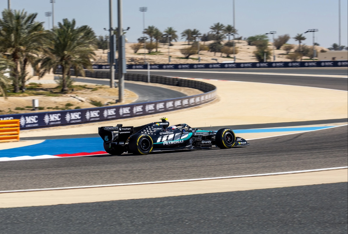 Side view of George Russell driving the Mercedes W17 through a corner at the Bahrain International Circuit during Day 4 of pre-season testing.