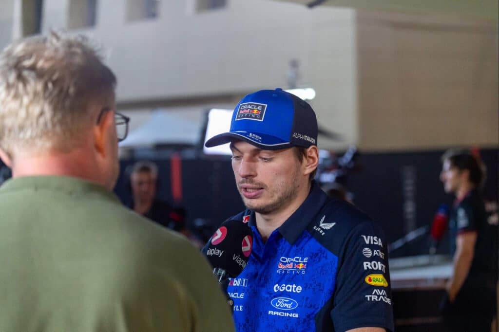 Max Verstappen during a media interview at the 2026 Bahrain pre-season testing, representing the human factor in Red Bull Racing's performance.