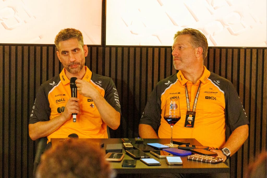 McLaren Team Principal Andrea Stella and CEO Zak Brown speaking at a press conference, highlighting the team's internal organizational cohesion.