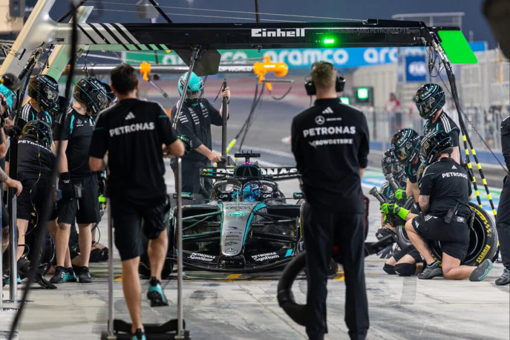 Mechanics working on the Mercedes W17 in the pit garage during the evening session of Day 4 pre-season testing at the Bahrain International Circuit.