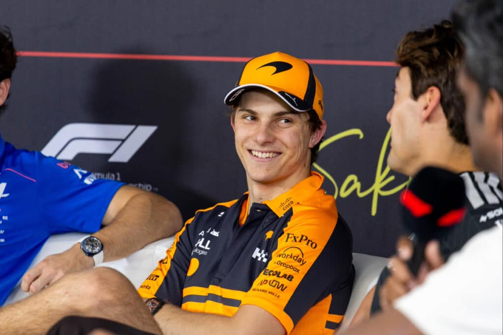 A smiling Oscar Piastri discussing McLaren’s optimization strategies for the upcoming Australian Grand Prix.