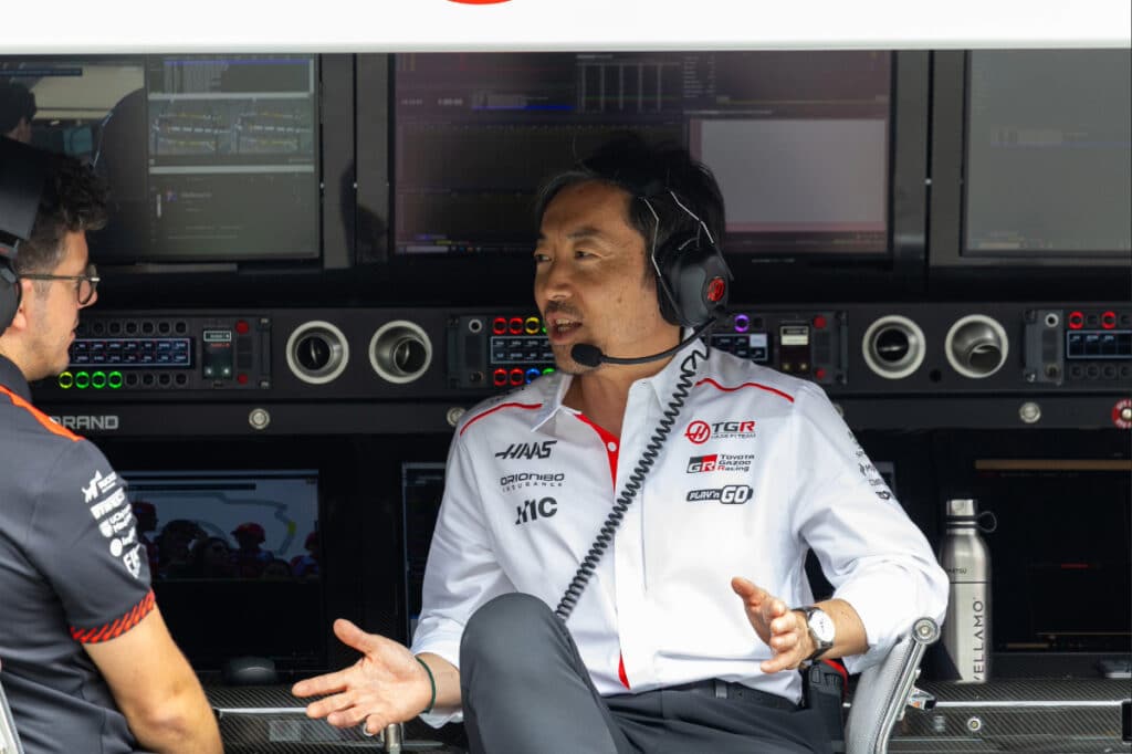 Haas Team Principal Ayao Komatsu standing in the Haas F1 Team garage in Shanghai.