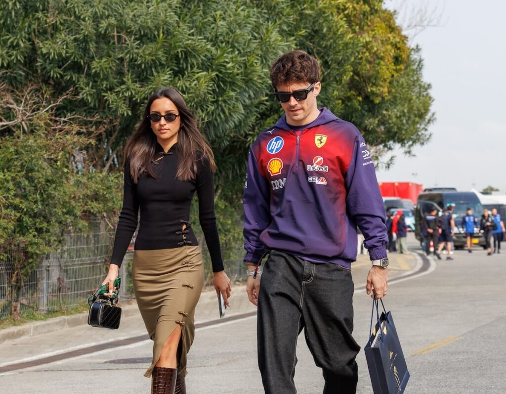 Charles Leclerc and wife Alexandra Saint-Mleux arrive at the 2026 Chinese Grand Prix paddock in Shanghai, showcasing the high-profile celebrity presence at the event.