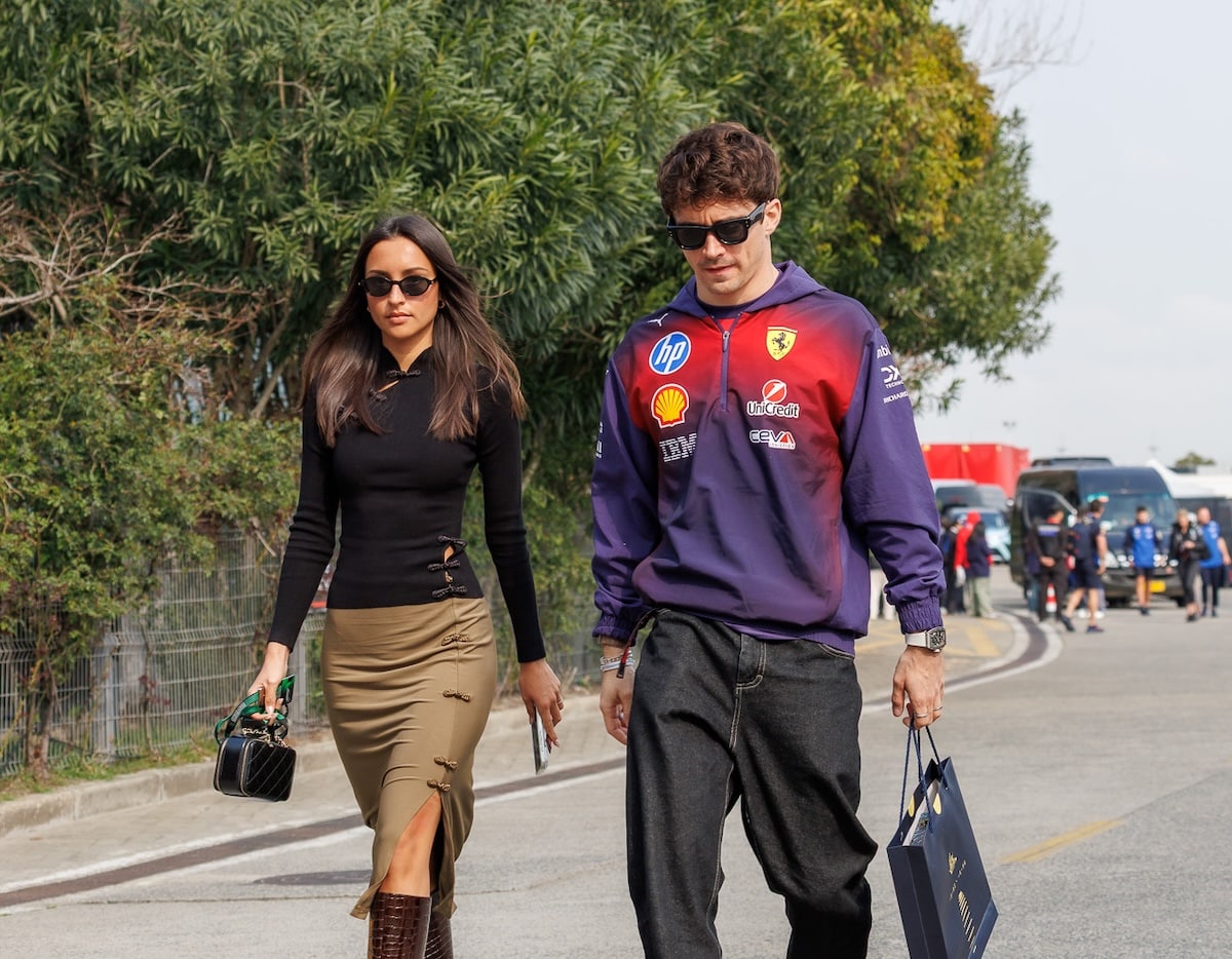 Charles Leclerc and wife Alexandra Saint-Mleux arrive at the 2026 Chinese Grand Prix paddock in Shanghai, showcasing the high-profile celebrity presence at the event.