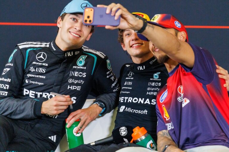 2026 Chinese Grand Prix winner Kimi Antonelli taking a selfie with Mercedes teammate George Russell and Lewis Hamilton.