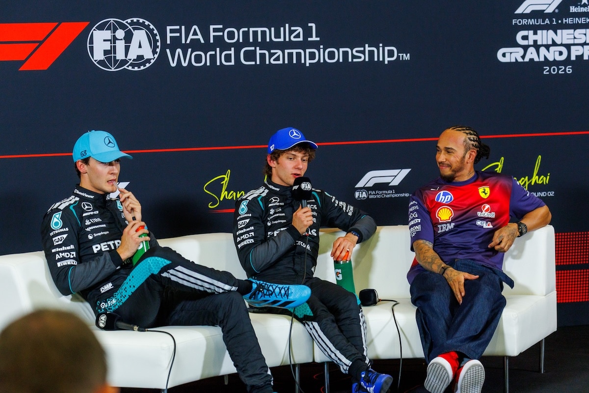 Kimi Antonelli speaking at the 2026 Chinese Grand Prix press conference alongside George Russell and Lewis Hamilton after becoming the youngest polesitter in F1 history.