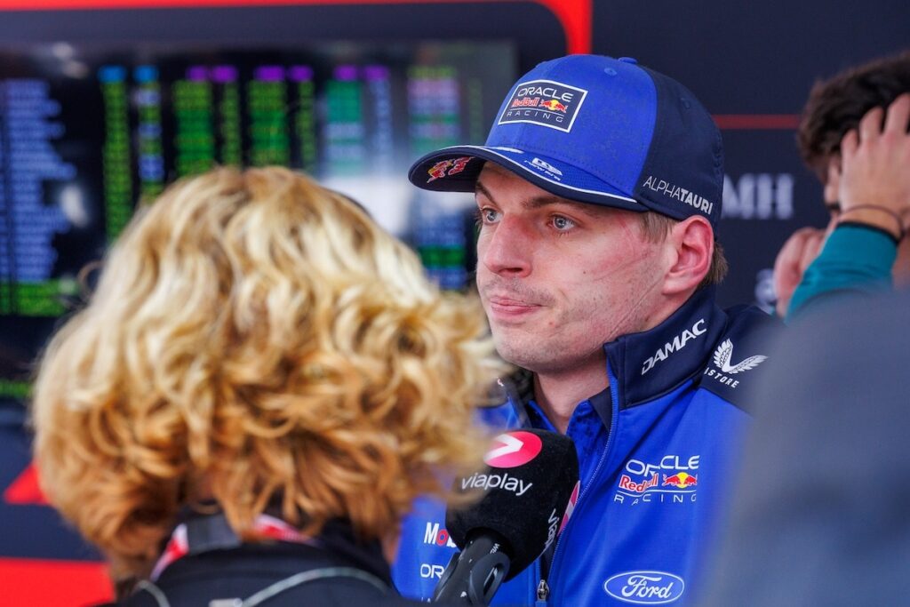 Max Verstappen in Red Bull Ford team gear looking concerned during a media interview, reflecting Red Bull Racing's challenging start to the 2026 Formula 1 season.