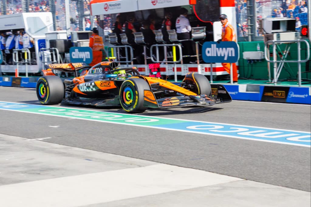 Oscar Piastri's McLaren navigating the wet Albert Park circuit during the 2025 Australian Grand Prix, illustrating the unpredictable weather conditions.